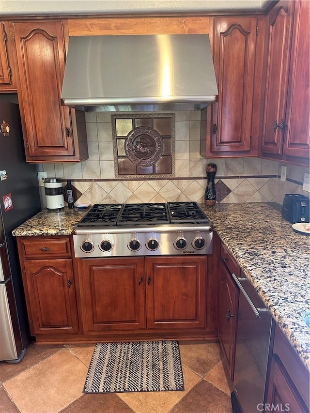 34300 Lantern Bay Dr Unit 41, Dana Point, CA 92629 - kitchen featuring stainless steel appliances, wall chimney range hood, decorative backsplash, and dark stone countertops