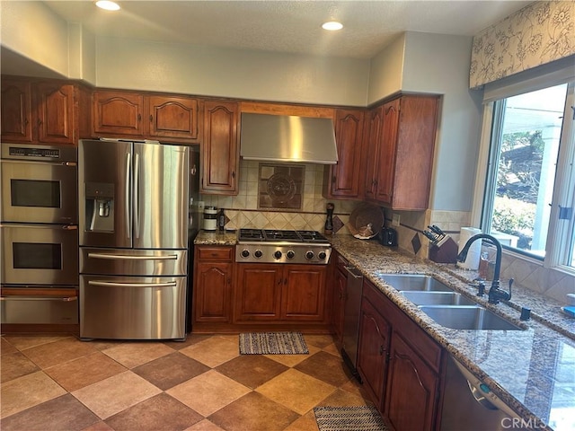 34300 Lantern Bay Dr Unit 41, Dana Point, CA 92629 - kitchen with appliances with stainless steel finishes, wall chimney range hood, a sink, backsplash, and a warming drawer