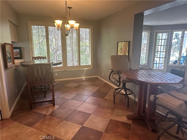 34300 Lantern Bay Dr Unit 41, Dana Point, CA 92629 - tiled dining area with plenty of natural light, a chandelier, and baseboards