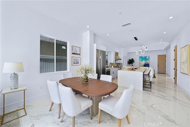 125 8th St, Huntington Beach, CA 92648 - dining area with light marble finish floors, recessed lighting, baseboards, and a chandelier