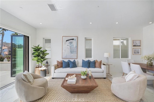 125 8th St, Huntington Beach, CA 92648 - living room featuring healthy amount of natural light, recessed lighting, and light marble finish floors