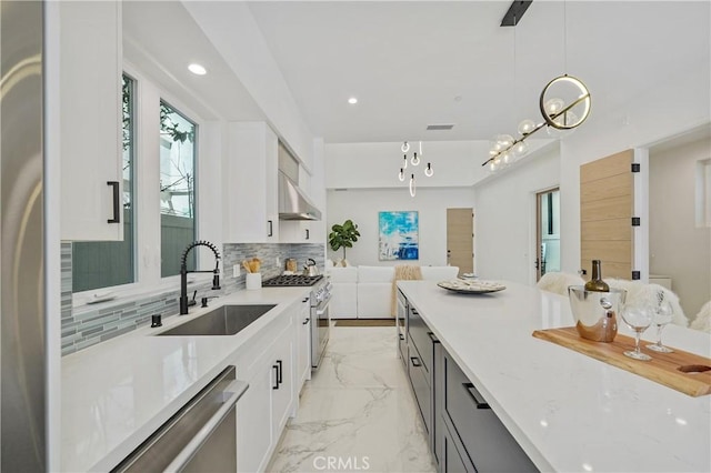 125 8th St, Huntington Beach, CA 92648 - kitchen with a sink, open floor plan, appliances with stainless steel finishes, white cabinetry, and recessed lighting