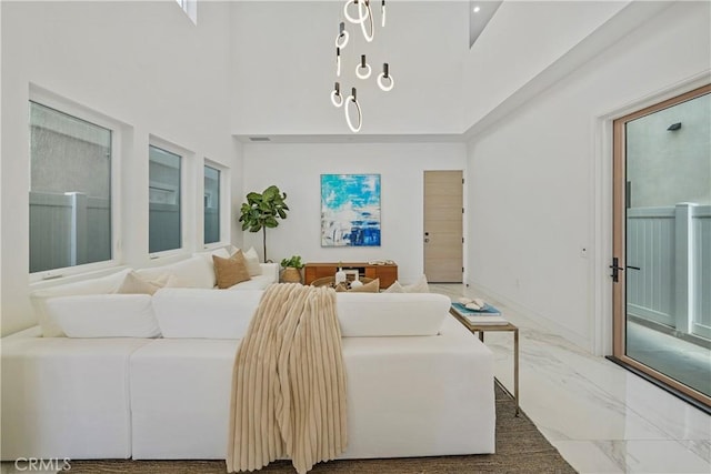 125 8th St, Huntington Beach, CA 92648 - bedroom with marble finish flooring, a high ceiling, and baseboards