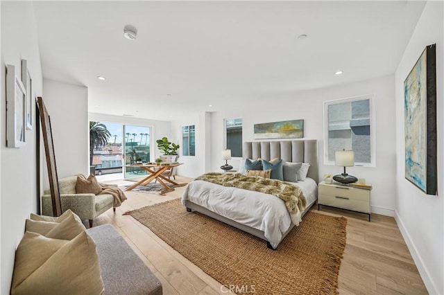 125 8th St, Huntington Beach, CA 92648 - bedroom featuring light wood finished floors, access to exterior, baseboards, and recessed lighting