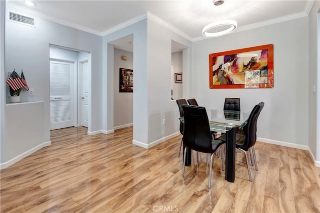 2230 Watermarke Pl, Irvine, CA 92612 - dining space featuring light wood-style flooring, crown molding, and baseboards