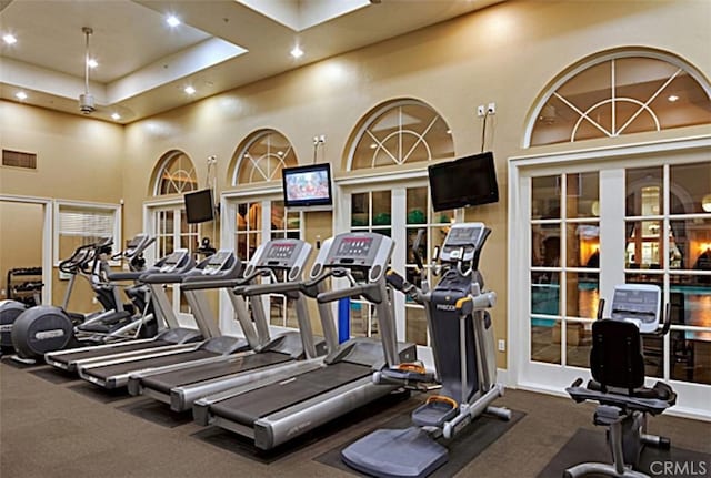 2230 Watermarke Pl, Irvine, CA 92612 - exercise room featuring recessed lighting, carpet flooring, and a towering ceiling
