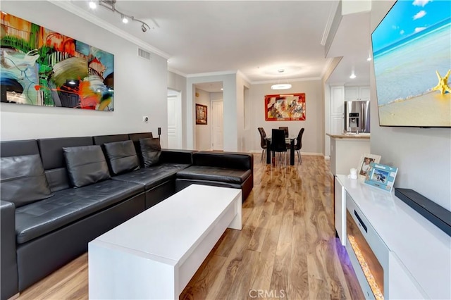 2230 Watermarke Pl, Irvine, CA 92612 - living room with crown molding and light wood-style flooring