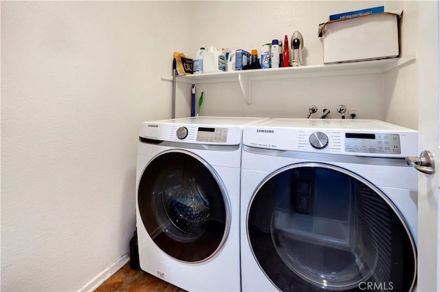 2230 Watermarke Pl, Irvine, CA 92612 - laundry room with separate washer and dryer and baseboards