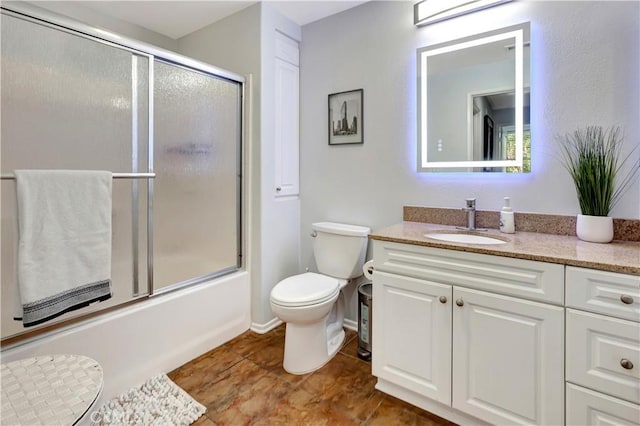 2230 Watermarke Pl, Irvine, CA 92612 - bathroom featuring vanity, toilet, enclosed tub / shower combo, tile patterned floors, and baseboards
