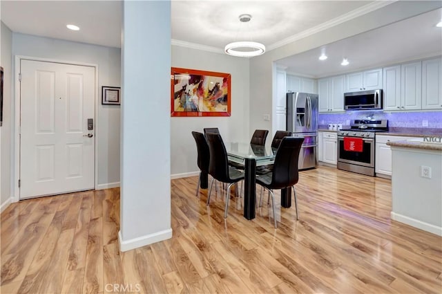 2230 Watermarke Pl, Irvine, CA 92612 - dining room featuring light wood-type flooring, crown molding, baseboards, and recessed lighting