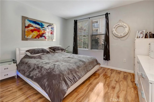 2230 Watermarke Pl, Irvine, CA 92612 - bedroom with light wood finished floors and baseboards