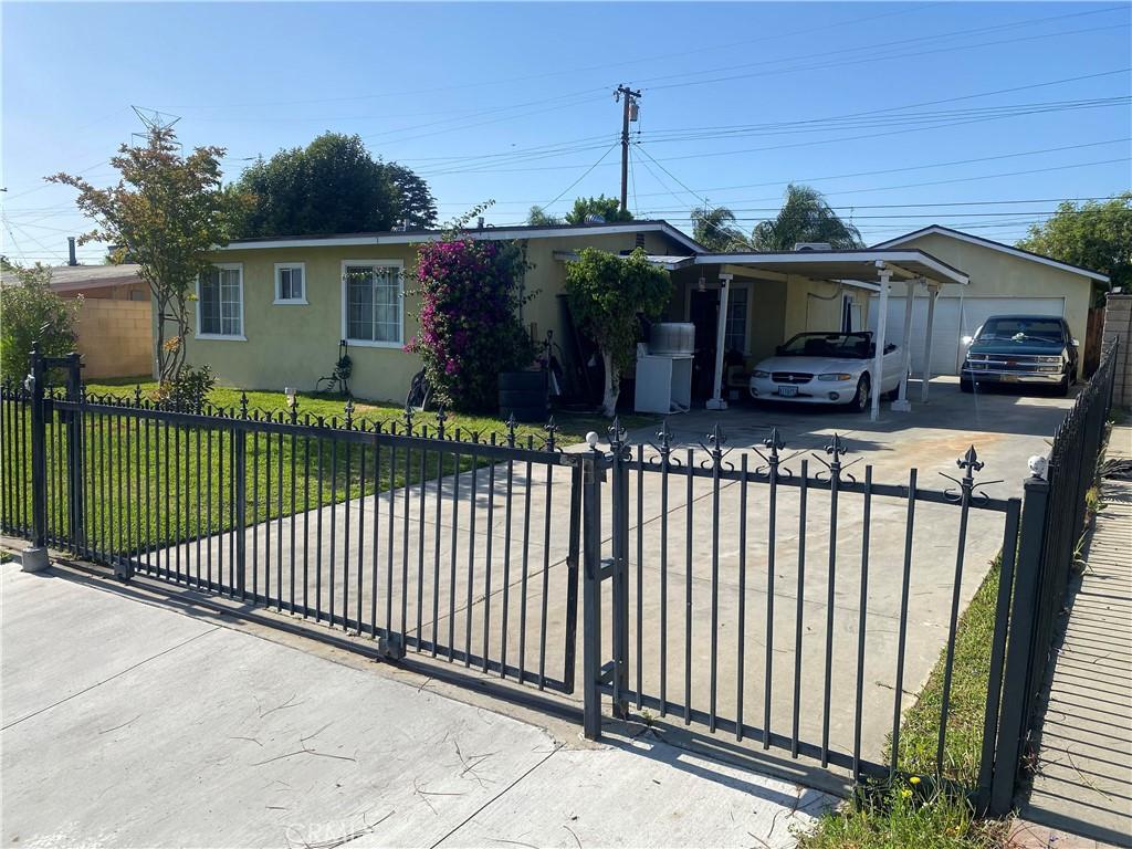 17909 E Laxford Rd, Azusa, CA 91702 - single story home featuring stucco siding, a fenced front yard, driveway, and a carport