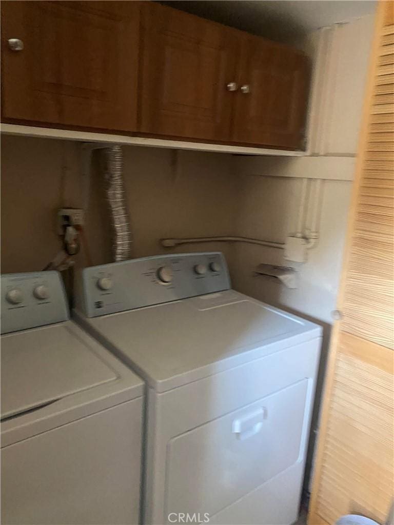 17909 E Laxford Rd, Azusa, CA 91702 - laundry room featuring washing machine and clothes dryer and cabinet space