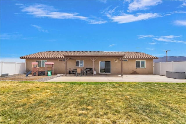 5824 White Fox Trl, Phelan, CA 92371 - rear view of property with stucco siding and a patio