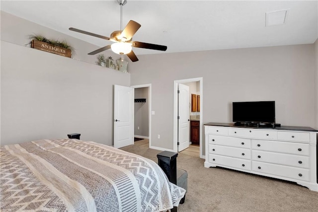 5824 White Fox Trl, Phelan, CA 92371 - bedroom featuring light carpet, a ceiling fan, ensuite bath, and baseboards