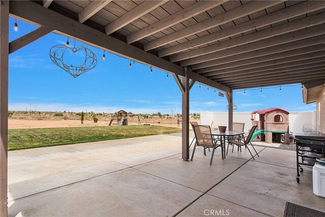 5824 White Fox Trl, Phelan, CA 92371 - view of patio featuring a playground and outdoor dining area