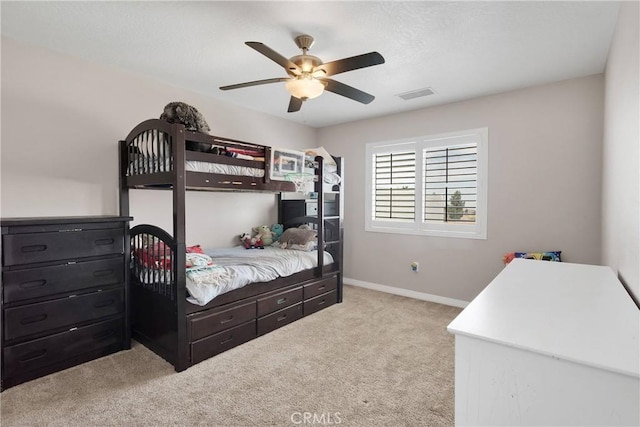 5824 White Fox Trl, Phelan, CA 92371 - bedroom featuring light colored carpet, baseboards, and a ceiling fan