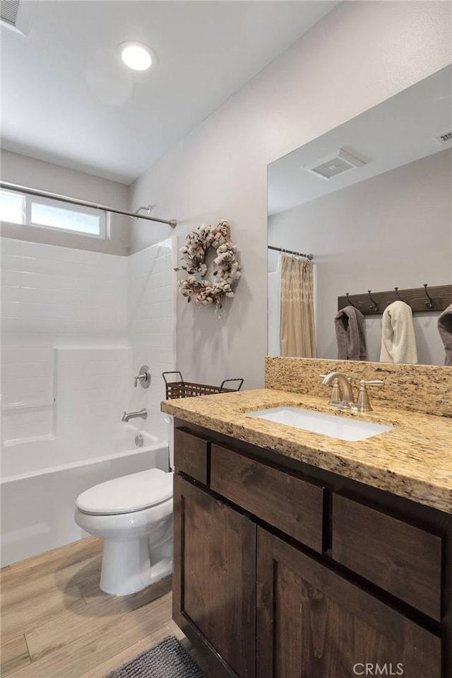 5824 White Fox Trl, Phelan, CA 92371 - bathroom with wood finished floors, toilet, shower / bathtub combination with curtain, and vanity