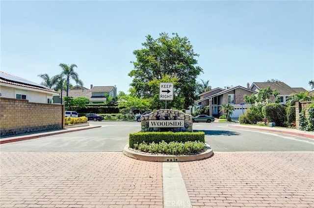 22492 Eloise Dr, Lake Forest, CA 92630 - view of asphalt road featuring a residential view, curbs, traffic signs, and sidewalks