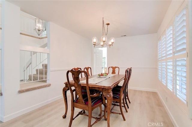 22492 Eloise Dr, Lake Forest, CA 92630 - dining space with a chandelier, light wood finished floors, stairs, and baseboards
