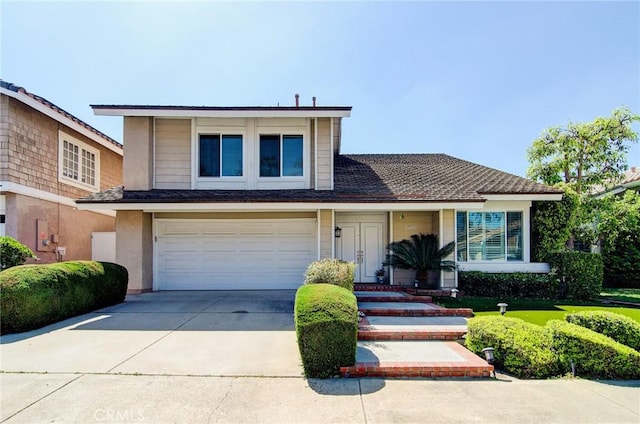 22492 Eloise Dr, Lake Forest, CA 92630 - view of front of house with concrete driveway and an attached garage