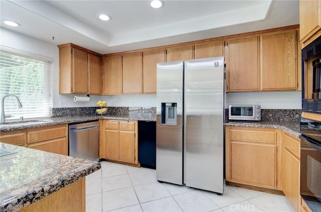 22492 Eloise Dr, Lake Forest, CA 92630 - kitchen featuring appliances with stainless steel finishes, a tray ceiling, a sink, light tile patterned floors, and recessed lighting