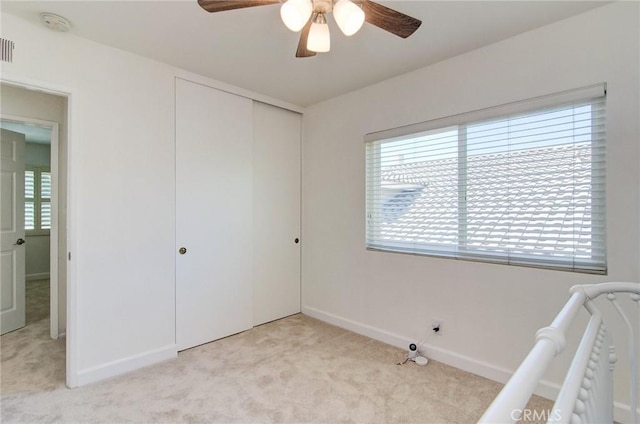22492 Eloise Dr, Lake Forest, CA 92630 - unfurnished bedroom with light carpet, a closet, baseboards, and a ceiling fan