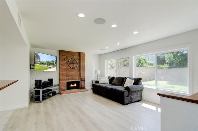 22492 Eloise Dr, Lake Forest, CA 92630 - living room with recessed lighting, a fireplace, wood finished floors, and baseboards