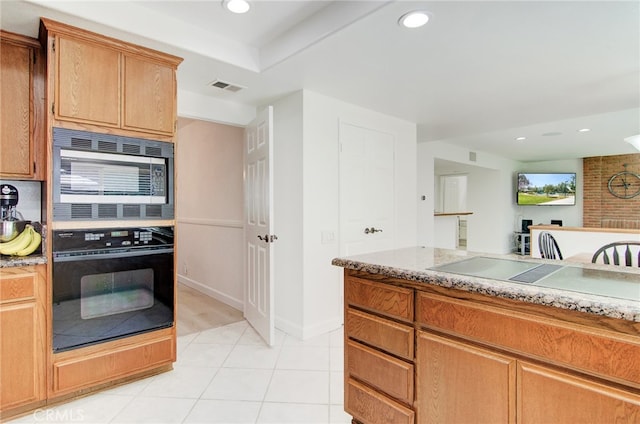 22492 Eloise Dr, Lake Forest, CA 92630 - kitchen featuring oven, built in microwave, recessed lighting, light tile patterned floors, and baseboards