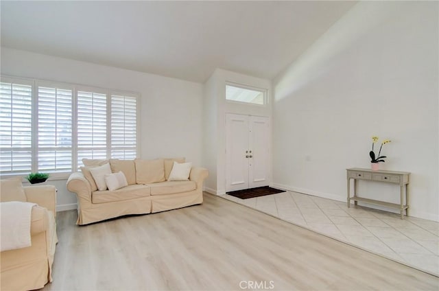 22492 Eloise Dr, Lake Forest, CA 92630 - living area featuring plenty of natural light, wood finished floors, and baseboards