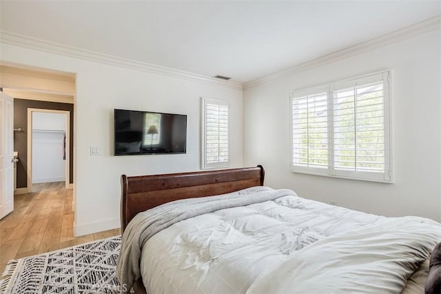 86 Canyoncrest, Irvine, CA 92603 - bedroom with ornamental molding, light wood-type flooring, multiple windows, and baseboards