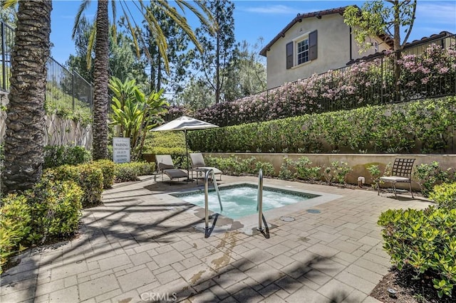 86 Canyoncrest, Irvine, CA 92603 - view of swimming pool with a hot tub, fence, and a patio