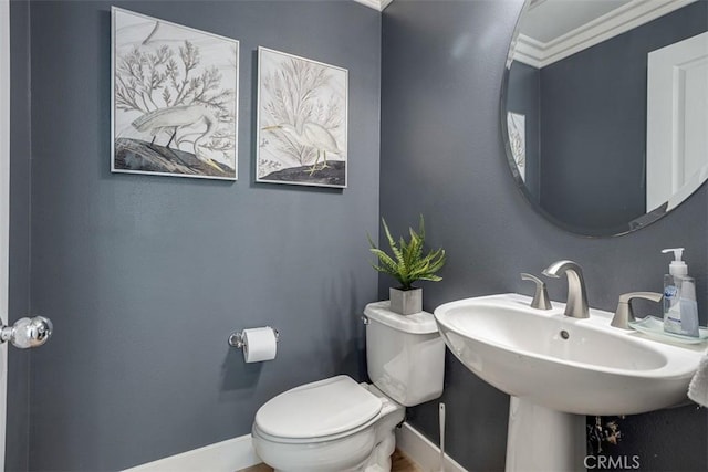 86 Canyoncrest, Irvine, CA 92603 - half bath featuring toilet, baseboards, and a sink