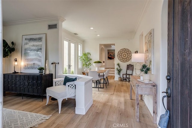 86 Canyoncrest, Irvine, CA 92603 - living area with light wood-style flooring, ornamental molding, recessed lighting, baseboards, and arched walkways