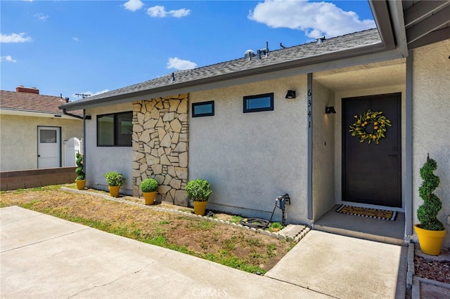 6341 Cerulean Ave, Garden Grove, CA 92845 - entrance to property featuring stucco siding, a patio, and a shingled roof