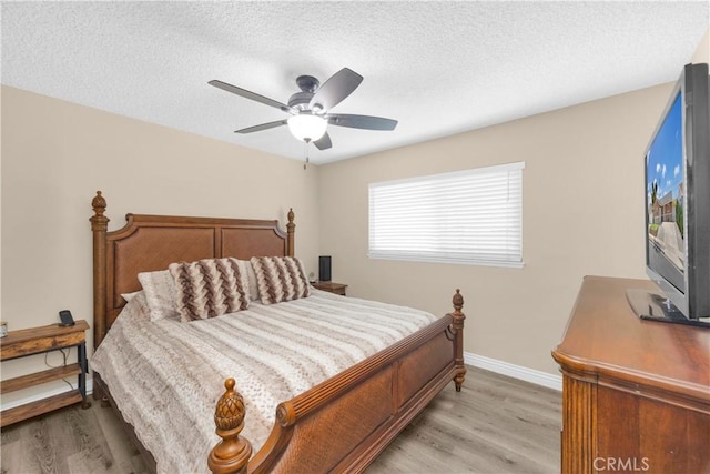 5182 Olga Ave, Cypress, CA 90630 - bedroom featuring light wood-type flooring, baseboards, a textured ceiling, and ceiling fan