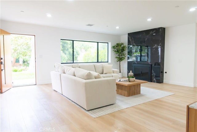 539 Avon Ave, Pasadena, CA 91105 - living room featuring light wood finished floors, healthy amount of natural light, recessed lighting, and baseboards