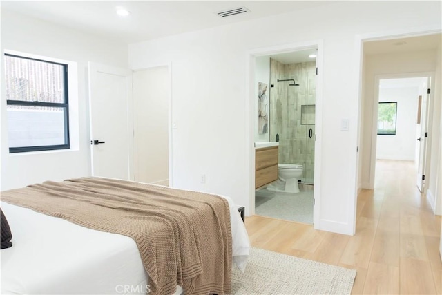 539 Avon Ave, Pasadena, CA 91105 - bedroom with light wood finished floors, ensuite bathroom, recessed lighting, and baseboards