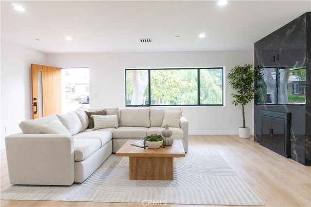 539 Avon Ave, Pasadena, CA 91105 - living room featuring light wood-style floors, recessed lighting, healthy amount of natural light, and baseboards