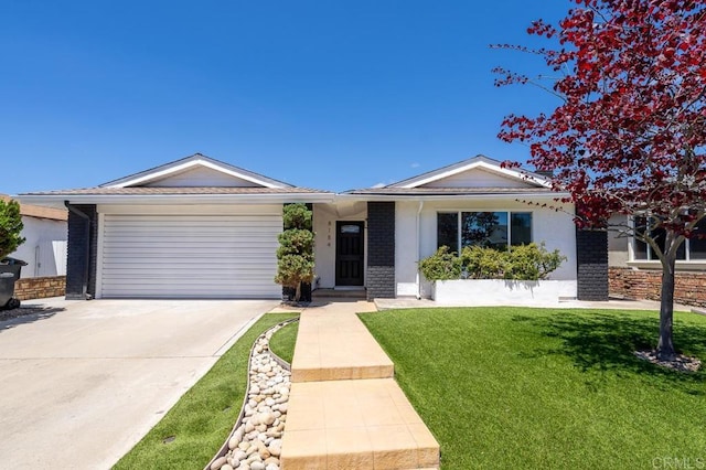 ranch-style home with an attached garage, concrete driveway, a front yard, and brick siding