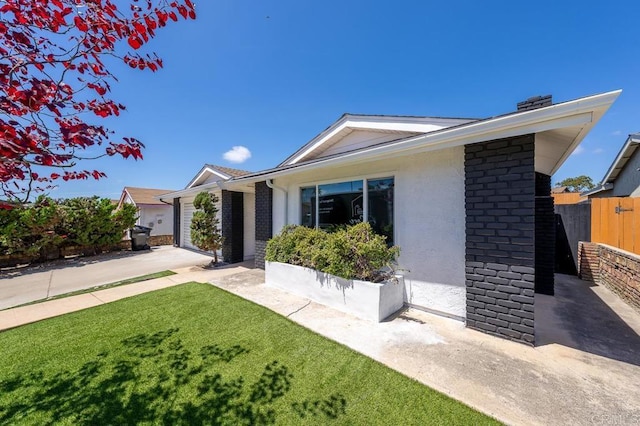view of front of home featuring a garage and stucco siding