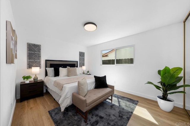 8184 Flanders Dr, San Diego, CA 92126 - bedroom featuring light wood-style floors and baseboards