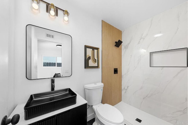 8184 Flanders Dr, San Diego, CA 92126 - full bath featuring toilet, vanity, and a marble finish shower