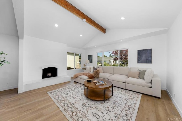 8184 Flanders Dr, San Diego, CA 92126 - living room featuring recessed lighting, light wood finished floors, a fireplace with raised hearth, and baseboards