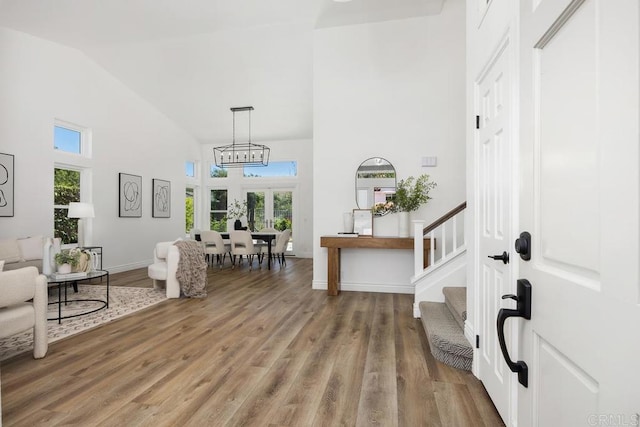 1707 Willowhaven Rd, Encinitas, CA 92024 - foyer with high vaulted ceiling, light wood-style flooring, stairway, and baseboards