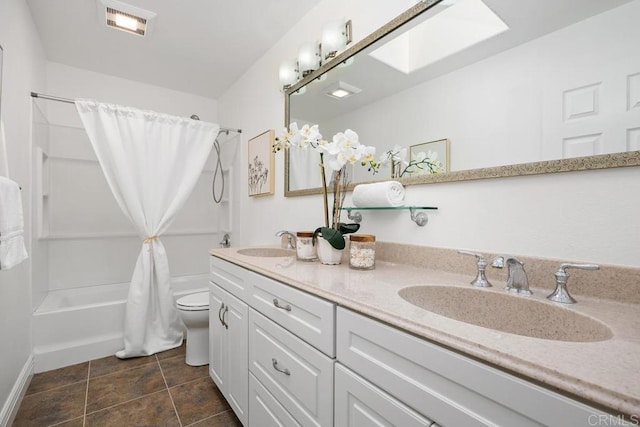 1707 Willowhaven Rd, Encinitas, CA 92024 - bathroom featuring toilet, shower / tub combo with curtain, double vanity, tile patterned floors, and a skylight