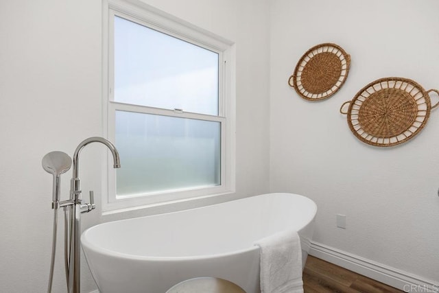 1707 Willowhaven Rd, Encinitas, CA 92024 - bathroom featuring wood finished floors, a soaking tub, and baseboards
