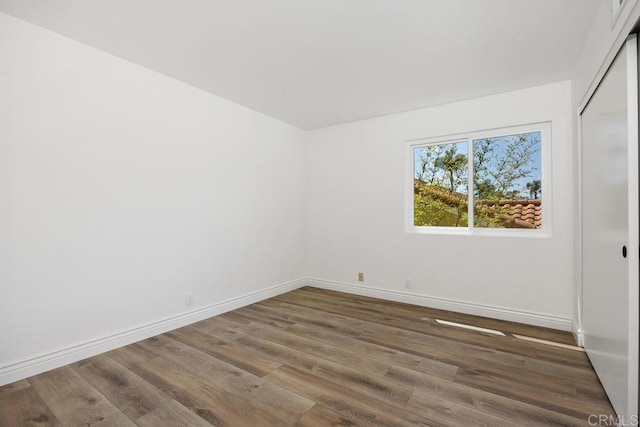 1707 Willowhaven Rd, Encinitas, CA 92024 - empty room featuring wood finished floors and baseboards