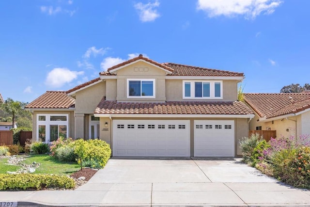 1707 Willowhaven Rd, Encinitas, CA 92024 - mediterranean / spanish house with concrete driveway, stucco siding, and a tile roof