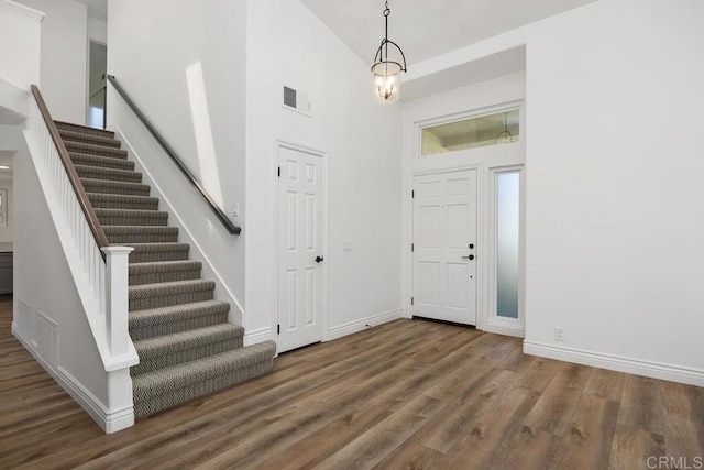 1707 Willowhaven Rd, Encinitas, CA 92024 - entrance foyer with a towering ceiling, stairs, wood finished floors, and baseboards